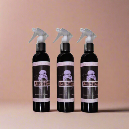 three product bottles of SShe Ain't Tangled, synthetic wig detangling sprays